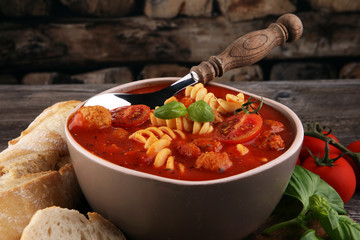 Tomato soup with meatballs in a bowl. Italian minestrone soup