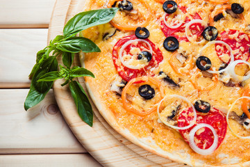 Assorted Pizza on the wooden background