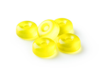 Yellow candies isolated on white