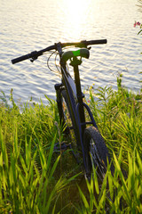 Mountain biking on the shore of the lake. Outdoor sports
