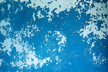 Old blue paint on a white wall, texture