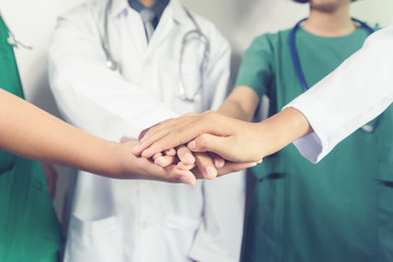 Surgeon doctors and nurses coordinate hands Teamwork,working together as team for motivation,...