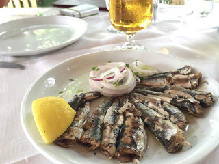 beer and sardines on table