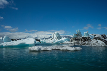 Iceland - Giant melting ice floes drifting on glacial lake