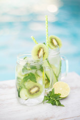 Detox with Cucumber, kiwi and lime around the pool
