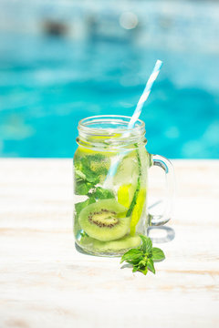 Detox with Cucumber, kiwi and lime around the pool