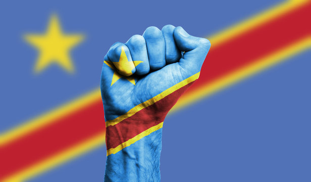 Democratic republic of Congo flag painted on a clenched fist. Strength, Power, Protest concept