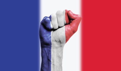 France flag painted on a clenched fist. Strength, Power, Protest concept