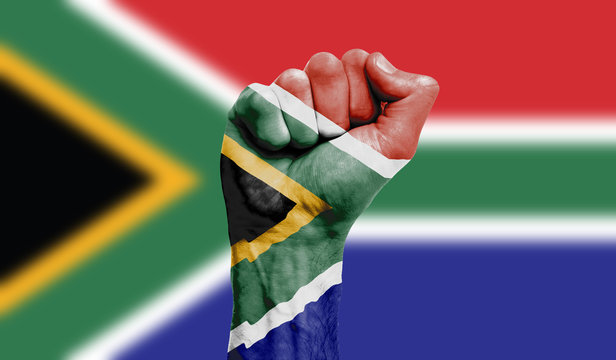 South Africa flag painted on a clenched fist. Strength, Power, Protest concept