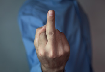 Man show fuck you sign.