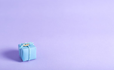 Little handmade present box on a bright background