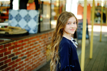 Kid girl in school uniform