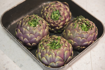 Fototapeta premium Cooking the artichokes