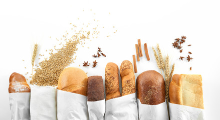 Composition of freshly baked delicious bread wheat and salt on the wooden table copyspace countryside kitchen bakery concept. 