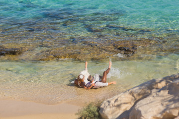 Bride and groom by the sea on their wedding day.