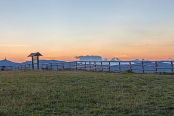 Fototapeta premium Sunset on Dolomites silhouette from Monte Pizzoc summit, Veneto, Italy