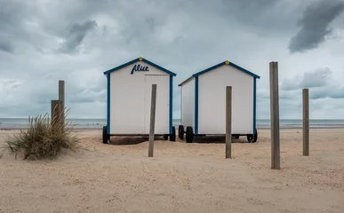 Gordijnen Two vintage beach cabins on a cloudy day in De Panne, Belgium. © Erik_AJV