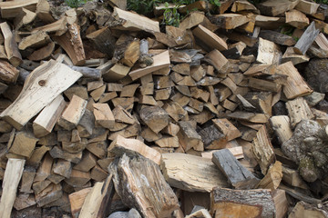 Pile of firewood. Preparation of firewood for the winter. Background