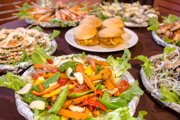 Nature, meat and sea dishes in the depth of field