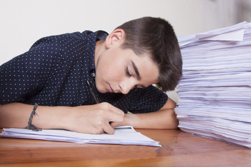 child student on the desk with stacked papers