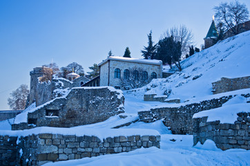 Fototapeta na wymiar Kalemegdan fortress covered with snow. Fortress is positioned at the confluence of rivers Danube and Sava, at the city of Belgrade, Serbia