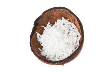 Half of the broken coconut filled with coconut shavings
