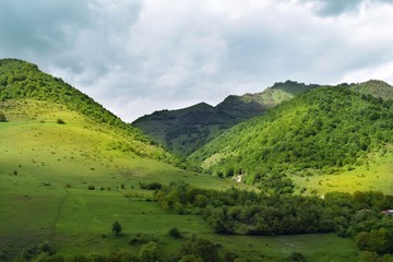 Obraz premium summer mountains green grass and blue sky landscape