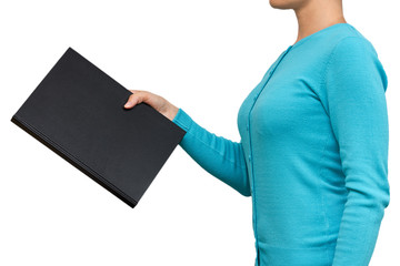 Girl with a big black notebook in her hands. isolated on white background