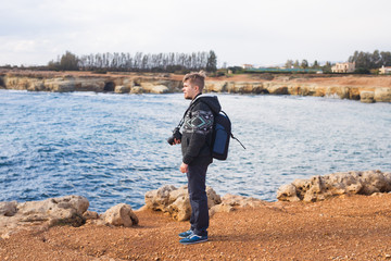 Fototapeta na wymiar Man traveler with backpack enjoying the natural surroundings.