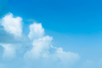 The sky is a small cloud floating in the sky.