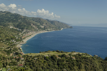 Fototapeta na wymiar Mediterranean coast at the height of the city of taormina sicily