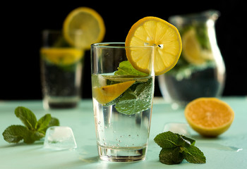 Cocktail mojito with ice. Dark background. Low key
