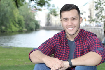 Obraz premium Cute boy smiling in the park close up with copy space