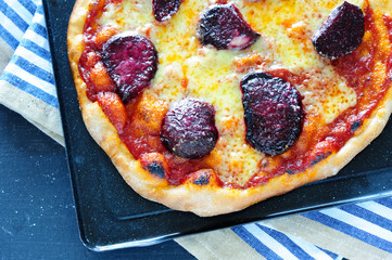 delicious homemade pizza on a platter - 167975641