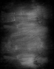 White chalk marks on blank black board chalkboard background
