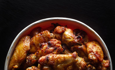 Chicken legs in a bucket.