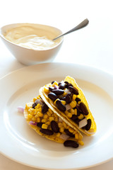 tacos with corn and bean served in plate with sauce - 167978633