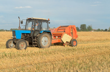 Special machines for harvesting form round bales of hay.