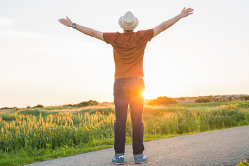Silhouette freedom man rise hands up inspire good morning. Christian worship praise God in...