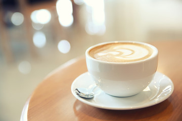 cappuccino coffee on wood background