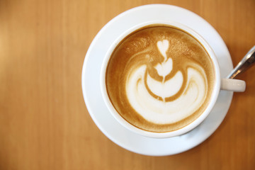 cappuccino coffee on wood background