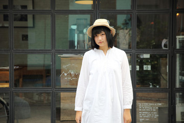 Asian young woman thinking and looking portrait with in coffee shop