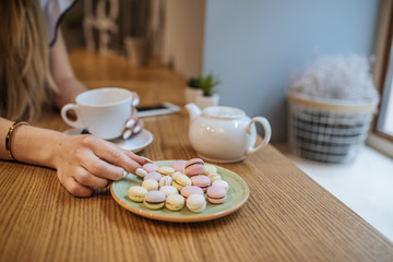 Beautiful girl with hot drink relaxing in  a cafe