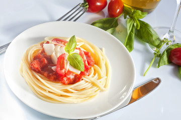 Spaghetti with tomato sauce and parmesan