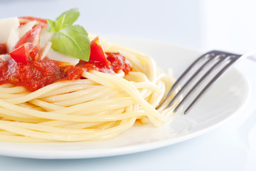 Spaghetti with tomato sauce and parmesan