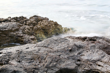 Fototapeta premium Aegean shore in Greece, Thassos island - waves and rocks - long exposure photography 