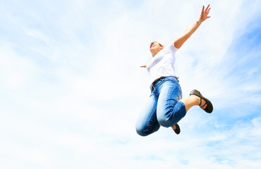 Obraz premium Woman In Her 50s Jumping High