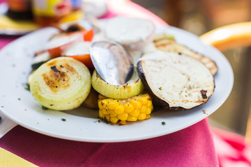 Delicious grilled vegetables on plate on table close-up