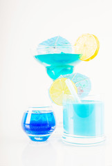 Colorful cocktail decorated with fruit, colorful umbrella, ice cubes, party night