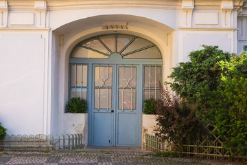 A front entrance of a home with a door